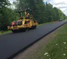 Rubber crumb road surfaces